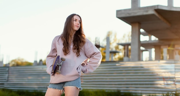 Medium shot girl with skateboard