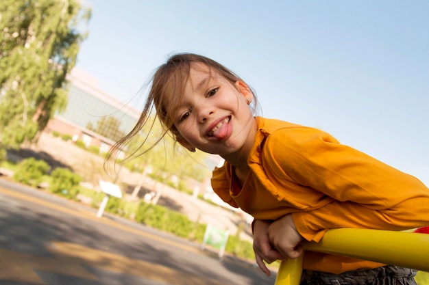 Medium shot girl with tongue out