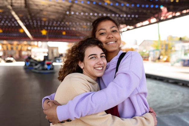 Medium shot girls at amusement park