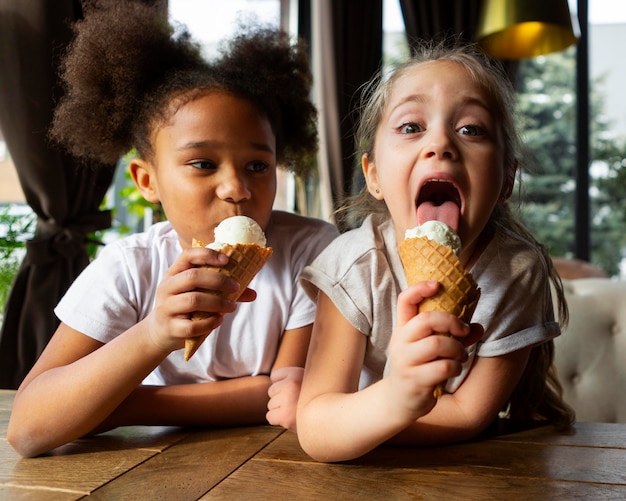 Medium shot girls eating ice cream