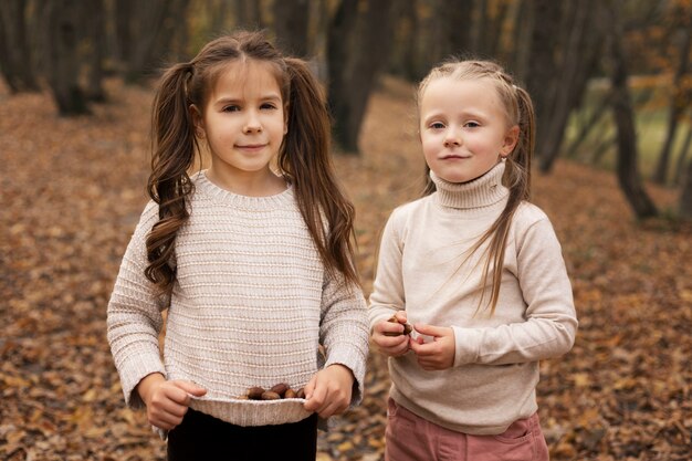 Medium shot girls in forest