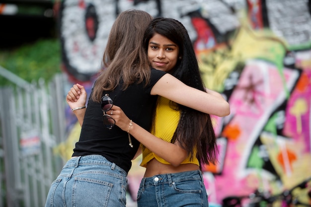 Medium shot girls hugging