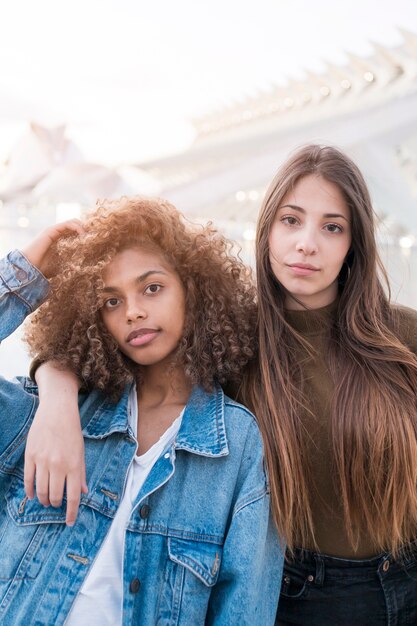 Medium shot girls posing outdoors