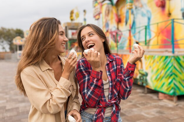 Medium shot girls with candy