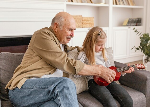 Medium shot grandfather and girl