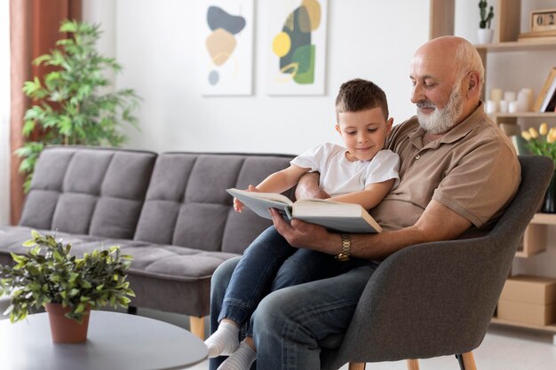 Medium shot grandfather holding kid