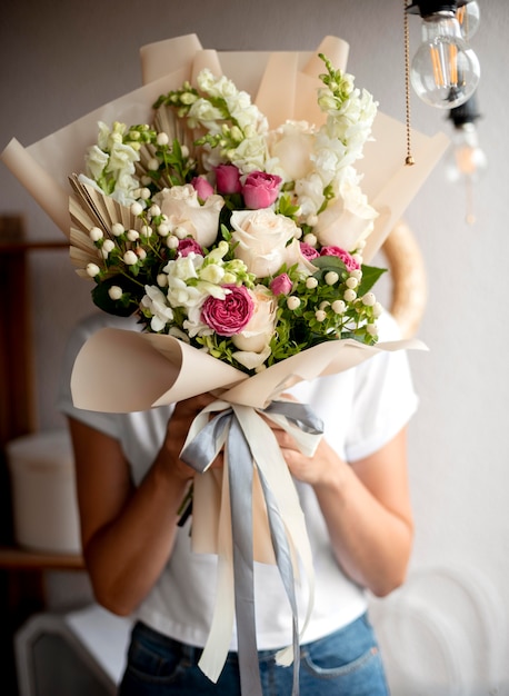 Medium shot hands holding flowers