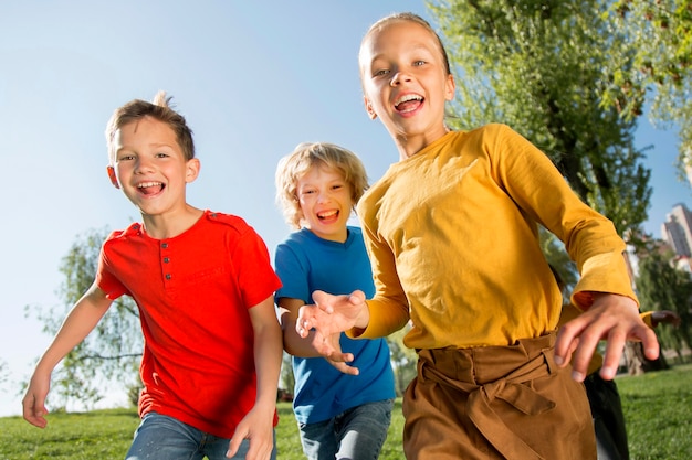 Medium shot happy children outdoors