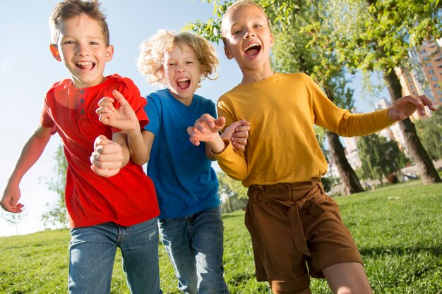 Medium shot happy children in park