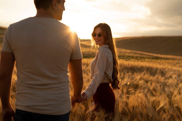 Medium shot happy couple holding hands