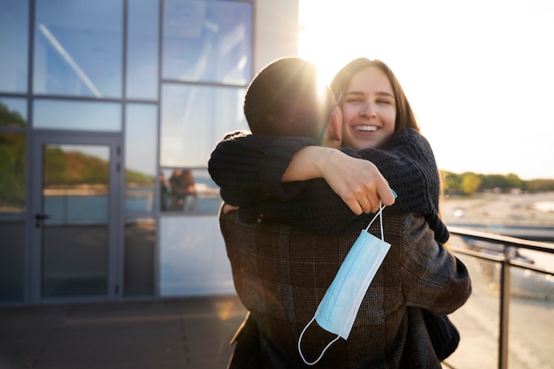 Free photo medium shot happy couple hugging