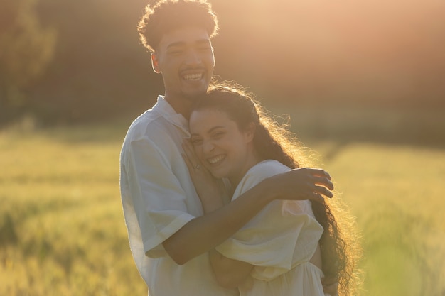 Medium shot happy couple hugging