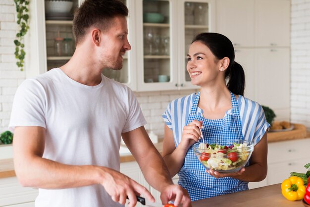 Medium shot happy couple in kitchen