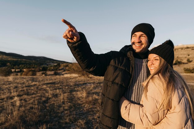 Medium shot happy couple outdoors