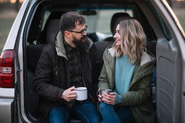 Medium shot happy couple in van