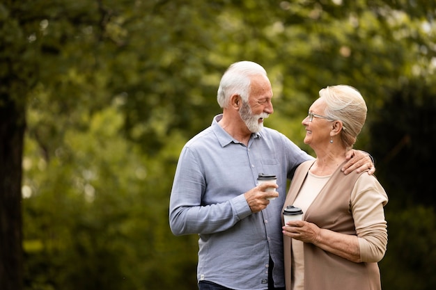 Medium shot happy couple with coffee