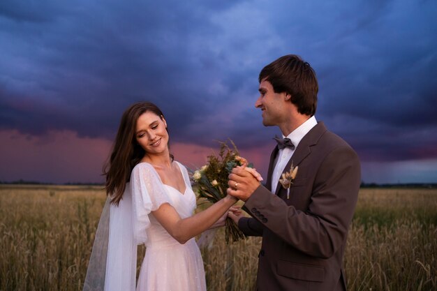 Medium shot happy couple with flowers