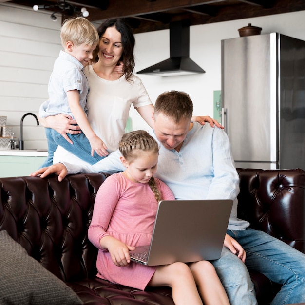 Medium shot happy family indoors