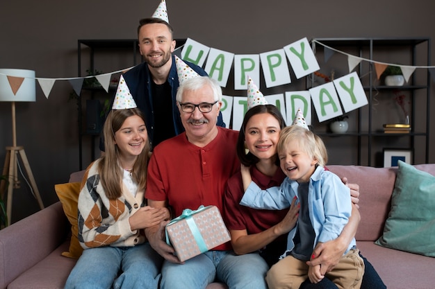 Medium shot happy family sitting together