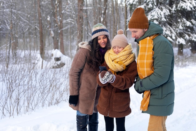 Medium shot happy family winter time