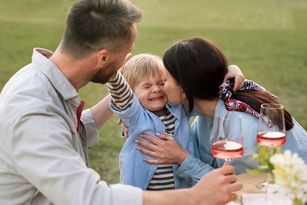 Medium shot happy family with child