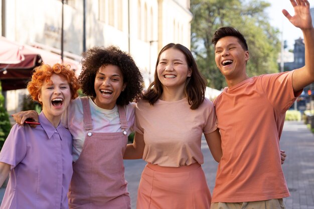 Medium shot happy friends outdoors