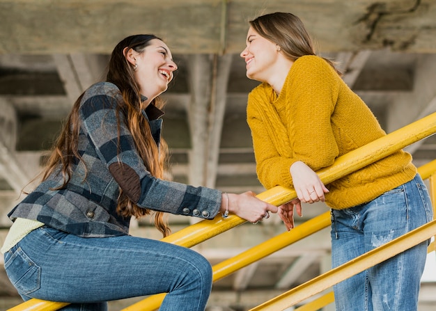 Free Photo medium shot happy girls looking at each other