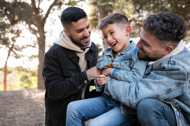 Medium shot happy lgbt family outdoors