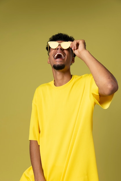 Medium shot happy man holding glasses