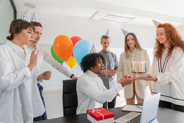 Medium shot happy people celebrating at work