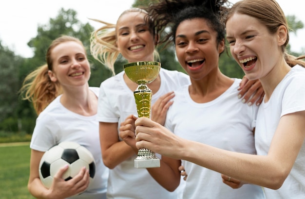 Free Photo medium shot happy women holding cup