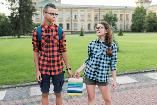 Free photo medium shot of highschool students holding books