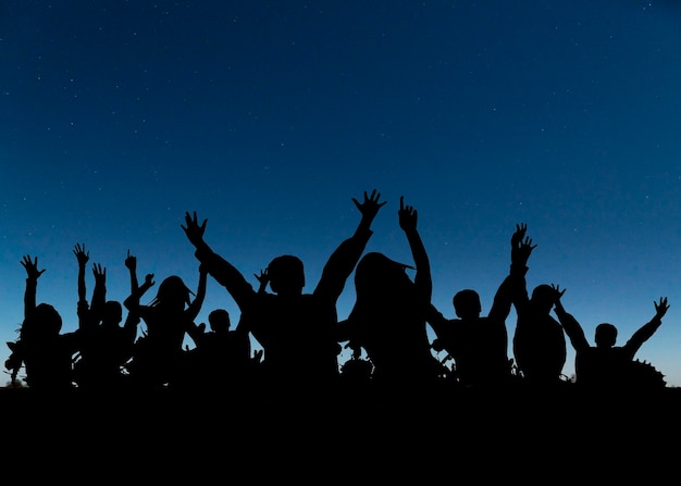 Medium shot human silhouettes partying together