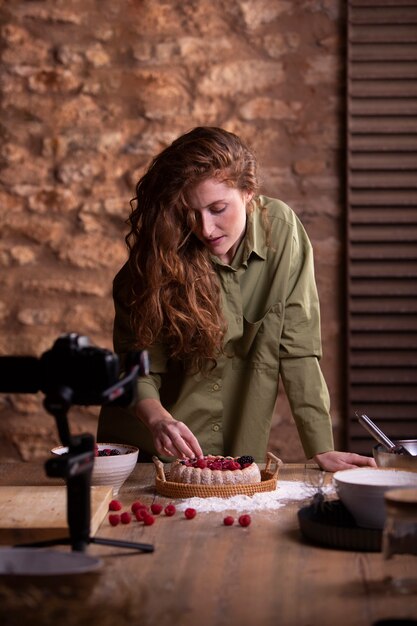 Medium shot influencer with delicious cake