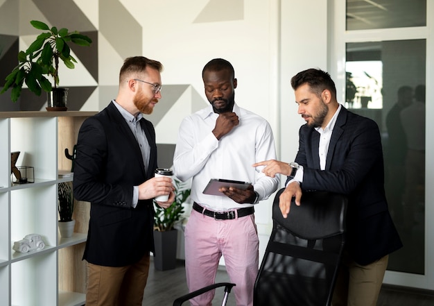 Free photo medium shot of interracial employees