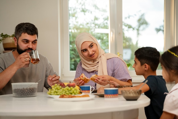 Medium shot islamic family eating