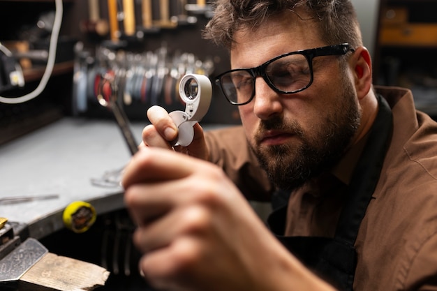 Medium shot jeweler making jewellery