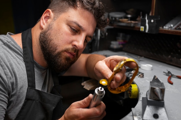 Medium shot jeweler making jewellery