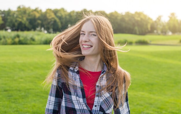 Medium shot joyful girl on a sunny day