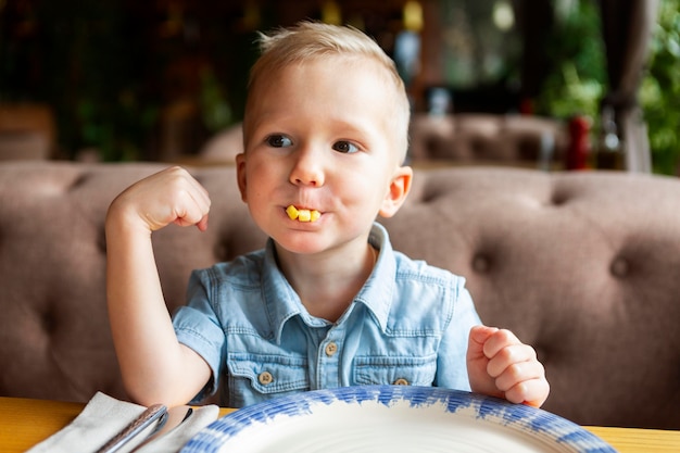 Medium shot kid eating fast food