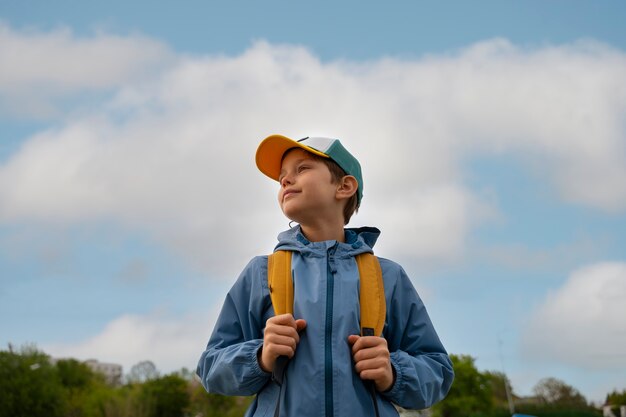 Medium shot kid exploring natural environment