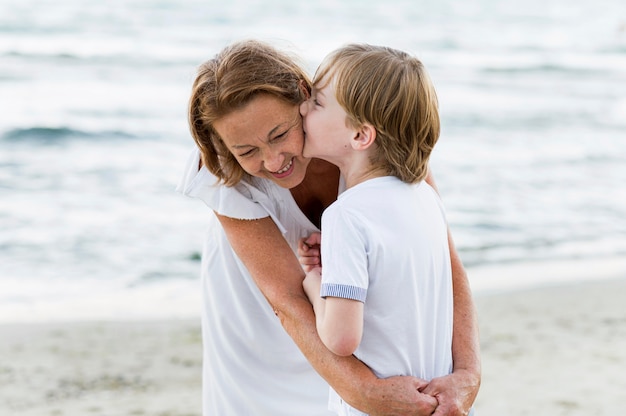 Medium shot kid kissing grandma