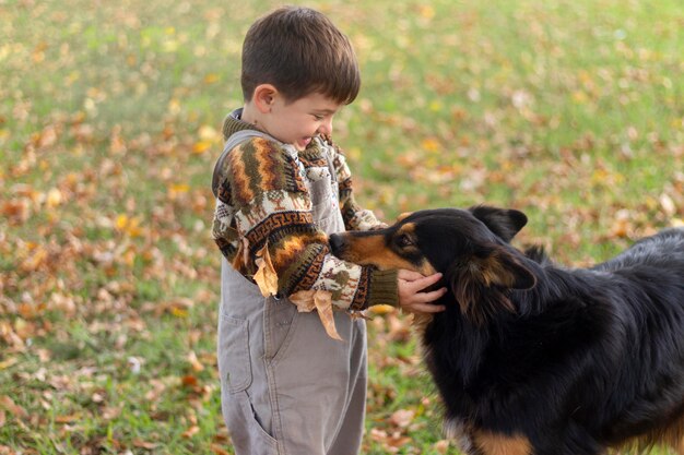 Medium shot kid petting dog