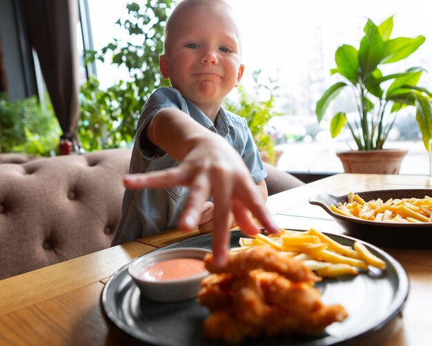 Medium shot kid taking food