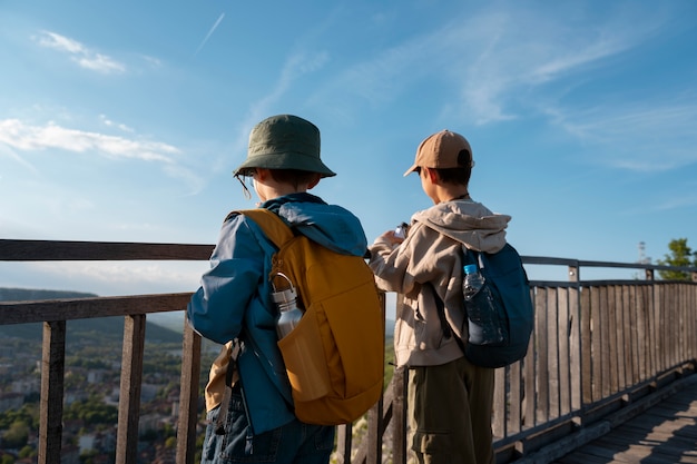 Medium shot kids exploring natural environment