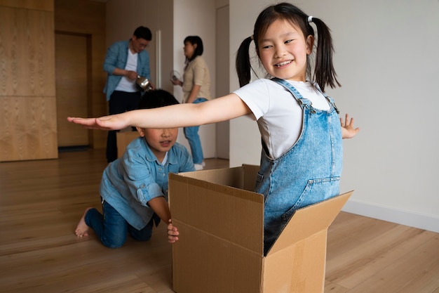 Medium shot kids playing with box