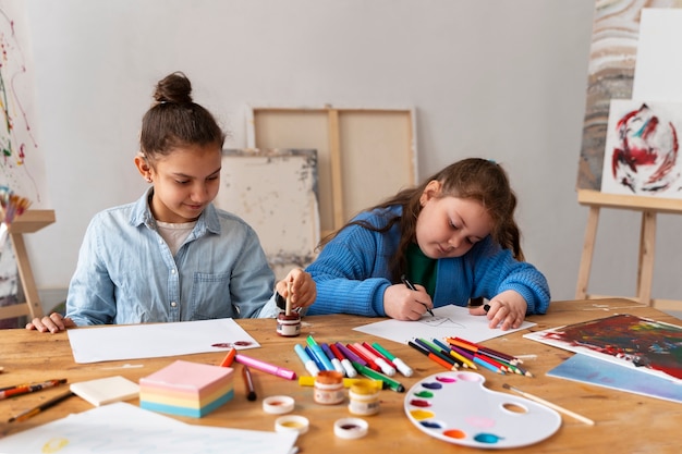 Free photo medium shot kids spending time at school