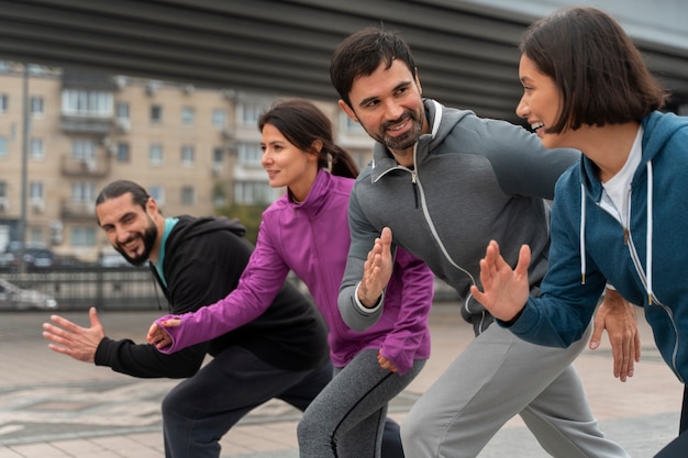 Medium shot latin people training outdoors