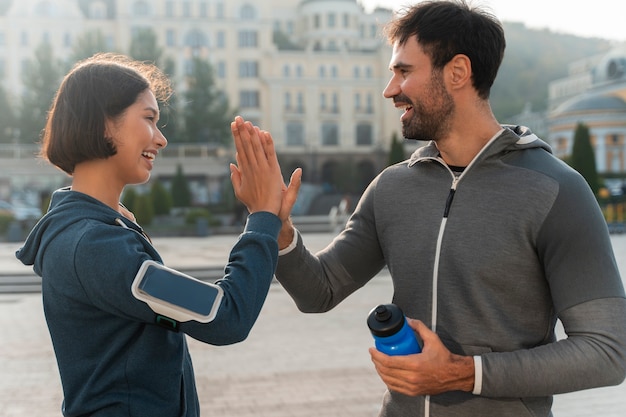 Medium shot latin people training outdoors