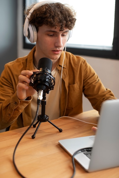 Medium shot man checking microphone